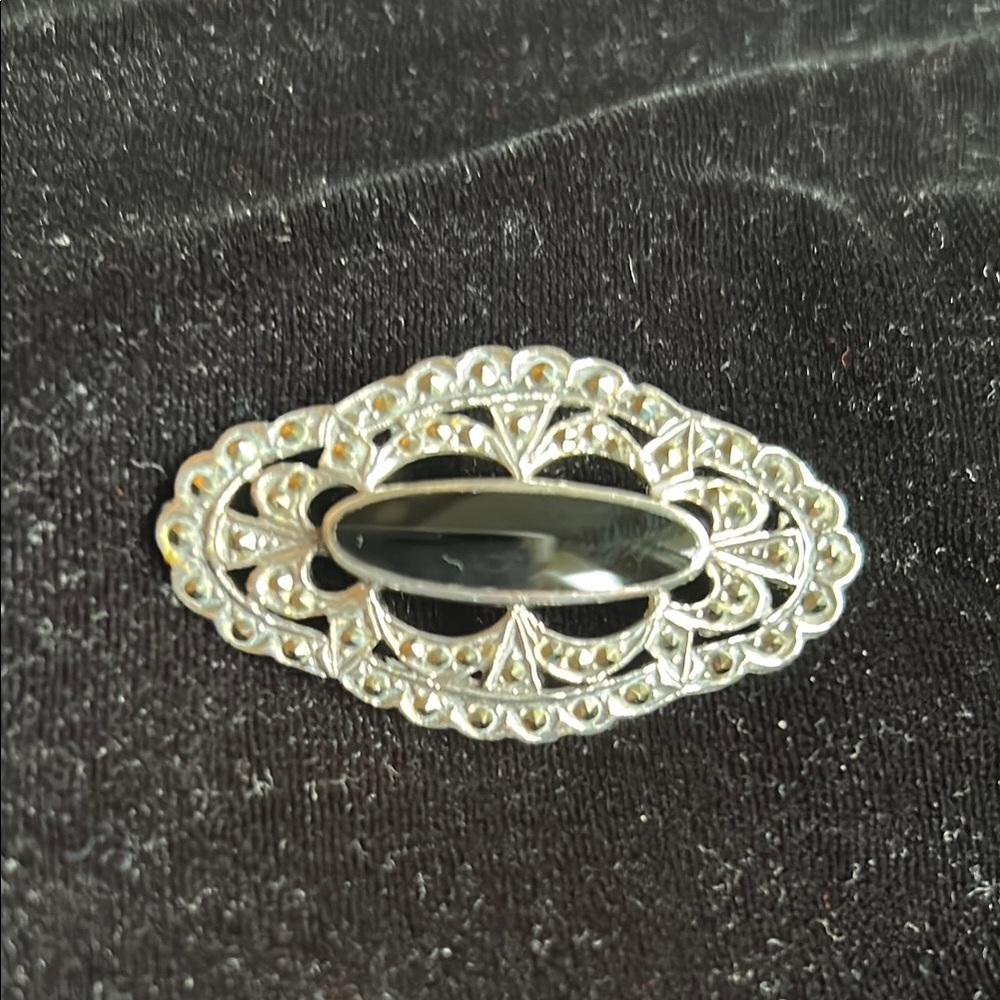 Intricate Silver and Black Filigree Brooch